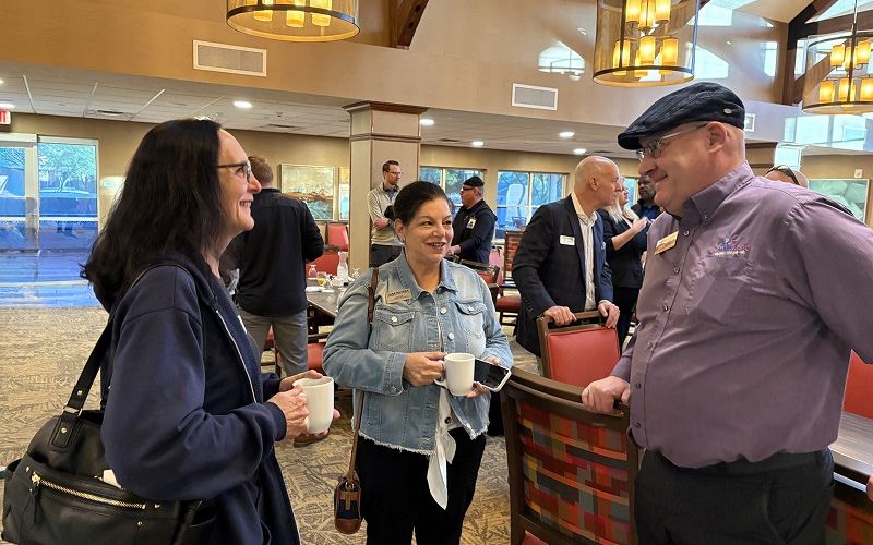 Local business owners networking at a Peoria Chamber event